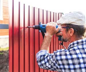 man building a fence