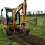 Excavator digging trench