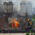 Firefighter putting out fire