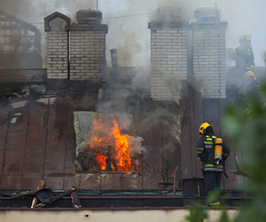 Firefighter putting out fire