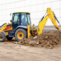 Excavator digging hole