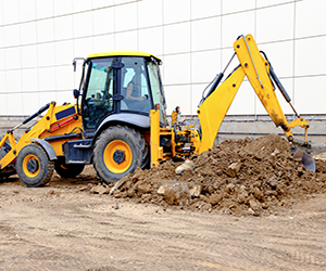 Excavator digging hole