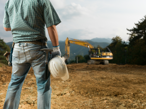 Worker with construction equipment