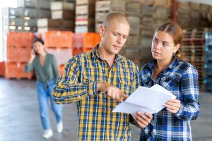 Manager instructing worker